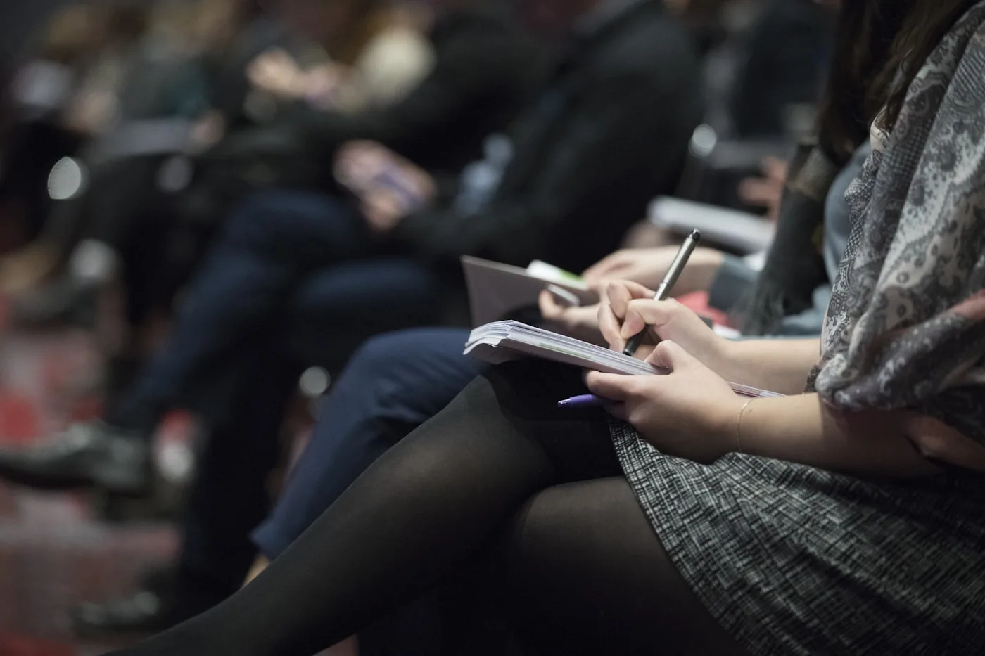 A researcher taking handwritten notes during a session